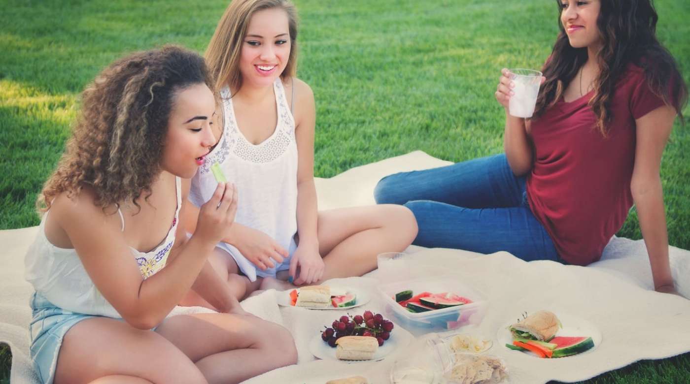 teen girls having picnic