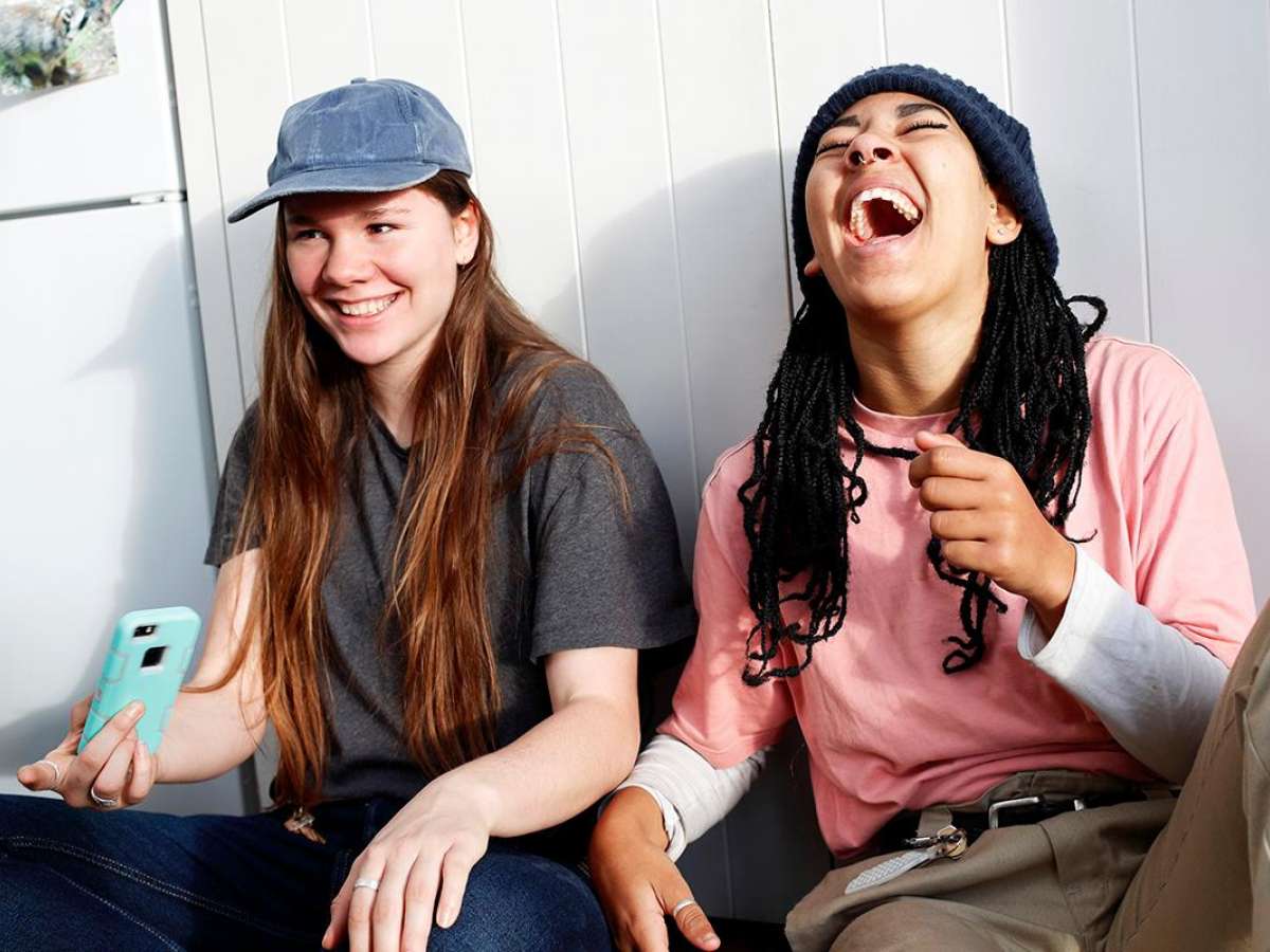 Two teen girls laughing